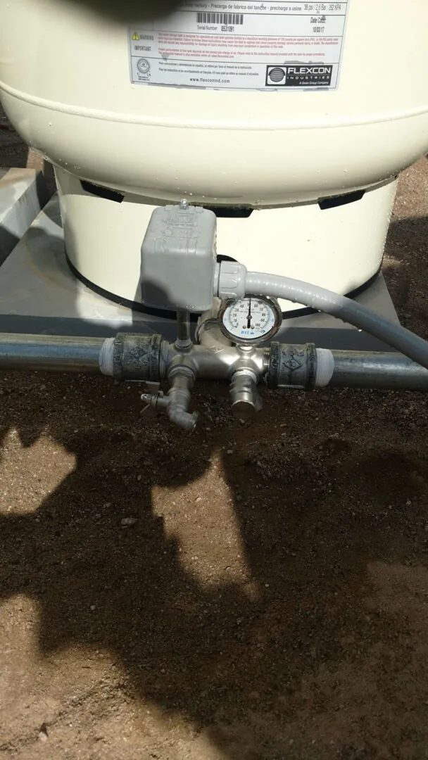 A new pressure tank on a tank tee with a pressure gauge, drain and unions